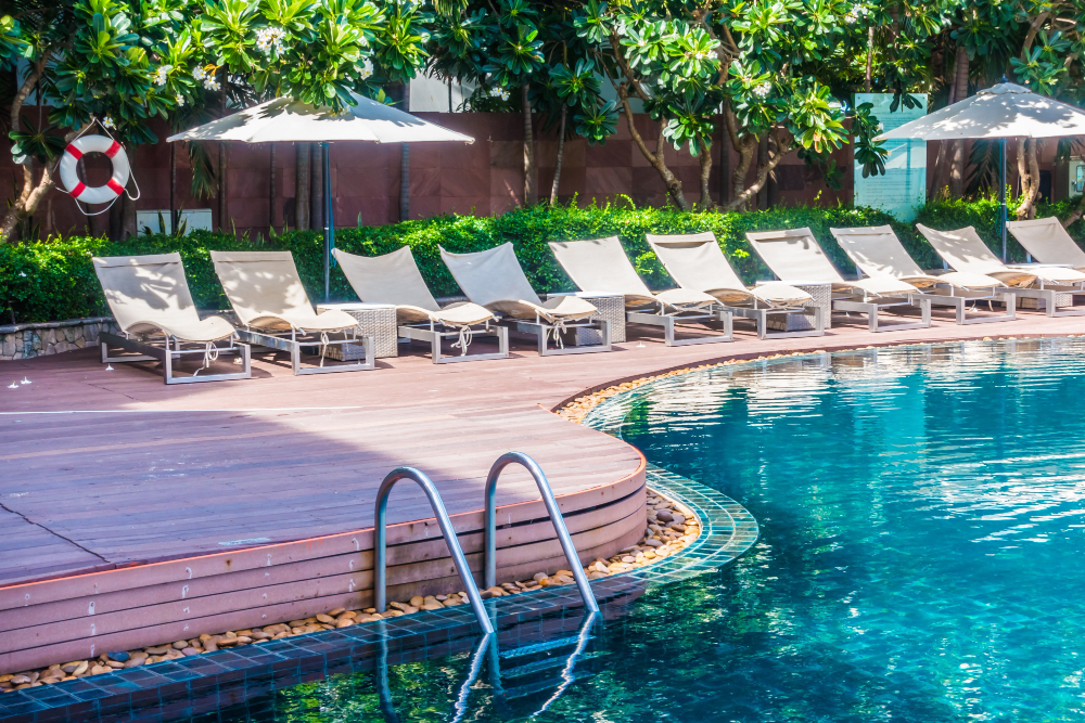 pool side with beach chairs